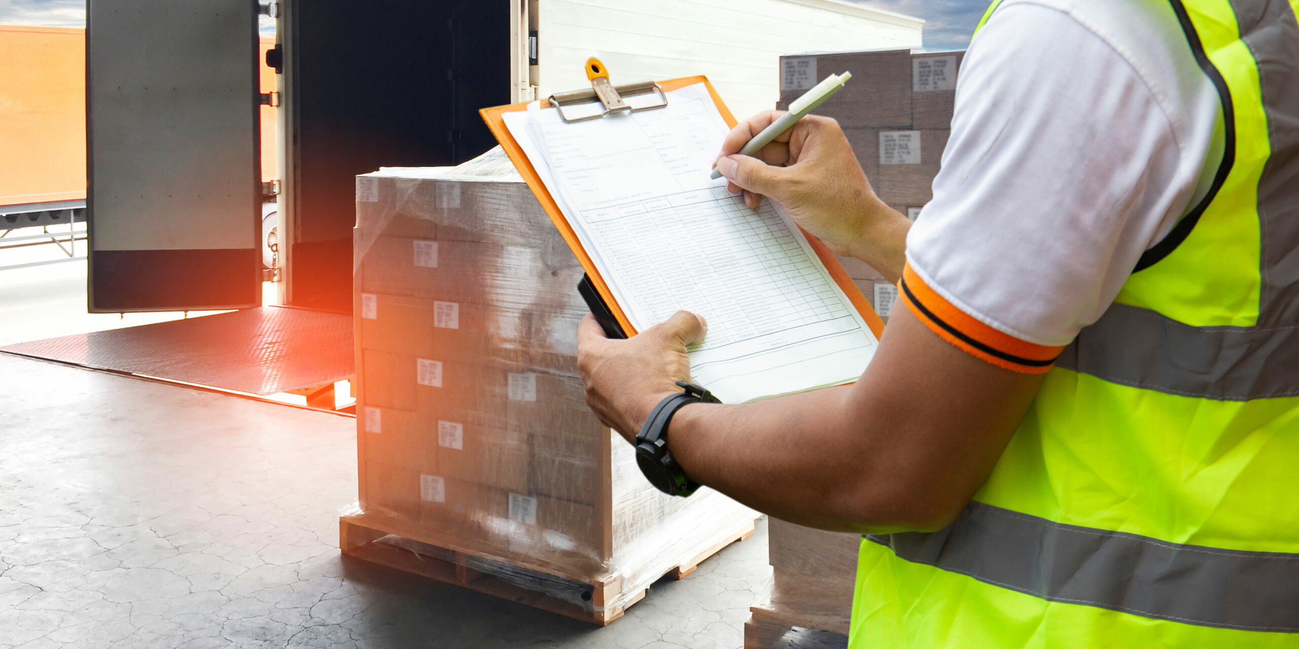 Worker,Courier,Holding,Clipboard,Control,Loading,Package,Box,Into,Cargo
